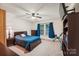 Bright bedroom with double bed, built-in shelving and ceiling fan at 111 David Ct, Fort Mill, SC 29715