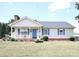 House exterior with blue shutters and front porch at 2815 Faircroft Way, Monroe, NC 28110