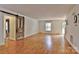 Spacious living room with hardwood floors and a sliding barn door at 13901 Phillips Rd, Matthews, NC 28105