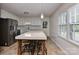 Modern kitchen featuring a large island and stainless steel appliances at 13901 Phillips Rd, Matthews, NC 28105