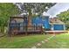 Home's exterior boasts a large deck and fenced yard at 13901 Phillips Rd, Matthews, NC 28105