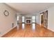 Spacious living room with hardwood floors, fireplace, and sliding barn door at 13901 Phillips Rd, Matthews, NC 28105
