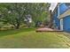 Blue house with deck and fenced backyard at 13901 Phillips Rd, Matthews, NC 28105
