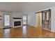 Living room with hardwood floors, fireplace and sliding barn door at 13901 Phillips Rd, Matthews, NC 28105