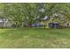 Large backyard with shed and mature tree at 13901 Phillips Rd, Matthews, NC 28105