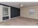 Spacious bedroom with neutral carpeting and ceiling fan at 13901 Phillips Rd, Matthews, NC 28105