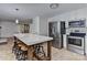 Modern kitchen with a large island and stainless steel appliances at 13901 Phillips Rd, Matthews, NC 28105