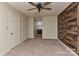 Bedroom with ceiling fan and wood-like wall accent at 13901 Phillips Rd, Matthews, NC 28105