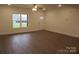 Spacious living room featuring hardwood floors and a ceiling fan at 1452 Ole Cambridge Cir, Clover, SC 29710