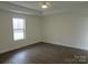 Spacious bedroom with large window and wood-look flooring at 3910 Jenkins Rd, Clover, SC 29710
