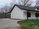 View of the home's side showcasing white siding and black accents at 3910 Jenkins Rd, Clover, SC 29710