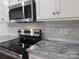 Stainless steel appliances and granite countertops in a modern kitchen at 3910 Jenkins Rd, Clover, SC 29710