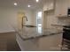 Kitchen island with granite countertop and stainless steel sink at 3910 Jenkins Rd, Clover, SC 29710