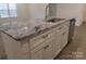 Granite kitchen island with stainless steel sink and faucet at 3910 Jenkins Rd, Clover, SC 29710