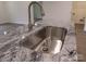 Stainless steel sink with modern faucet on granite countertop at 3910 Jenkins Rd, Clover, SC 29710