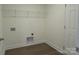 Bright laundry room features built-in shelving and vinyl flooring at 3910 Jenkins Rd, Clover, SC 29710