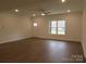 Bright living room with hardwood floors and large windows at 3910 Jenkins Rd, Clover, SC 29710