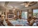 Living room with a stone fireplace, hardwood floors and a view at 34 Sandbar Dr, Taylorsville, NC 28681