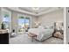 Main bedroom with king-size bed and access to backyard patio at 7567 Baybrooke Ln # 35, Harrisburg, NC 28075