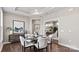 Elegant dining room with round table and seating for four at 7567 Baybrooke Ln # 35, Harrisburg, NC 28075