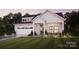 Modern farmhouse exterior with attached garage at 7567 Baybrooke Ln # 35, Harrisburg, NC 28075