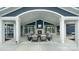 Relaxing poolside patio with fireplace and seating at 7567 Baybrooke Ln # 35, Harrisburg, NC 28075