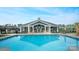 Community pool with spacious deck and lounge area at 7567 Baybrooke Ln # 35, Harrisburg, NC 28075