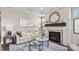 Living room with fireplace, hardwood floors, and comfortable seating at 7567 Baybrooke Ln # 35, Harrisburg, NC 28075