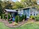 Landscaped backyard with pergola and seating area at 301 6Th Se St, Belmont, NC 28012