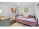 Small bedroom with daybed and window providing natural light at 301 6Th Se St, Belmont, NC 28012