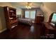 Charming bedroom with hardwood floors and built-in shelving at 926 Courtney Ct, Concord, NC 28025