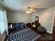 Bedroom with hardwood floors, ceiling fan, and ample closet space at 926 Courtney Ct, Concord, NC 28025