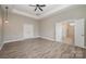 Main bedroom with wood-look floors and ensuite bath at 2009 Atherton Dr, Indian Trail, NC 28079