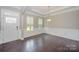 Formal dining room with hardwood floors and wainscoting at 2009 Atherton Dr, Indian Trail, NC 28079