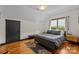 Serene bedroom with a double bed, hardwood floors, and a window view at 400 Ferrell Ave, Belmont, NC 28012