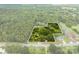 Aerial view of property with road frontage and wooded area at 4539 S New Hope Rd, Gastonia, NC 28056