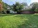 Large grassy backyard with home visible in background at 4539 S New Hope Rd, Gastonia, NC 28056