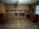 Gathering room with a brick fireplace and wood flooring at 4539 S New Hope Rd, Gastonia, NC 28056