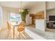 Charming dining area with a table and chairs, adjacent to the kitchen at 108 Daventry Pl, Mooresville, NC 28117