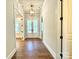 Bright entryway with hardwood floors and double doors leading to the backyard at 310 Scalybark Trl, Concord, NC 28027