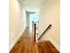 Hardwood floors and staircase in the upstairs hallway at 310 Scalybark Trl, Concord, NC 28027