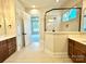 Elegant bathroom with double vanity, large shower, and view of bedroom at 310 Scalybark Trl, Concord, NC 28027