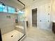 Bathroom features a walk-in shower and built-in bench at 310 Scalybark Trl, Concord, NC 28027