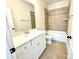 Bathroom with a white vanity, tile flooring and a tub at 310 Scalybark Trl, Concord, NC 28027