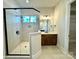 Large bathroom with a walk-in shower and a double vanity at 310 Scalybark Trl, Concord, NC 28027