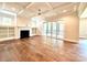 Bright living room with hardwood floors, fireplace, and access to outdoor space at 310 Scalybark Trl, Concord, NC 28027