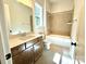 Bathroom with wood vanity, tile flooring and a tub at 310 Scalybark Trl, Concord, NC 28027