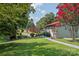 Landscaped backyard with large trees and walkway at 4120 Statesville Blvd, Salisbury, NC 28147