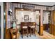A breakfast bar with two stools sits in the kitchen at 4120 Statesville Blvd, Salisbury, NC 28147