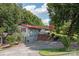 Ranch-style home with red roof and attached garage at 4120 Statesville Blvd, Salisbury, NC 28147